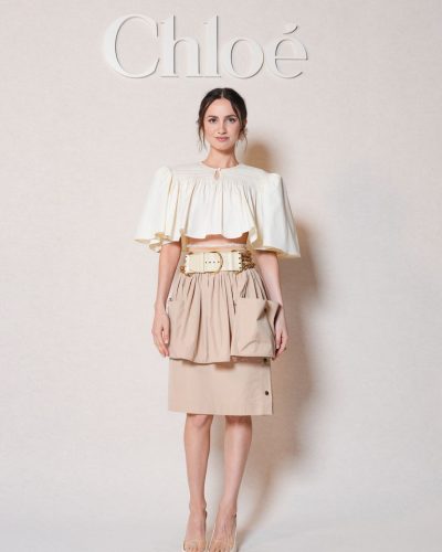 Maude Apatow beige pleated skirt with white cropped top