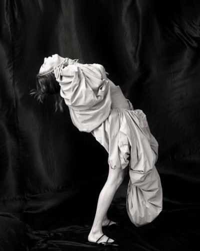 Maya Hawke in light silk top with soft hair framing