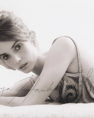 Maya Hawke in simple light top with dreamy backdrop