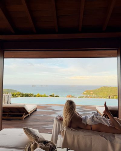 McKenzie Hewson with sun-kissed hair in flowing red dress