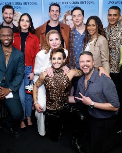 Melissa Barrera in a red jacket paired with tailored jeans