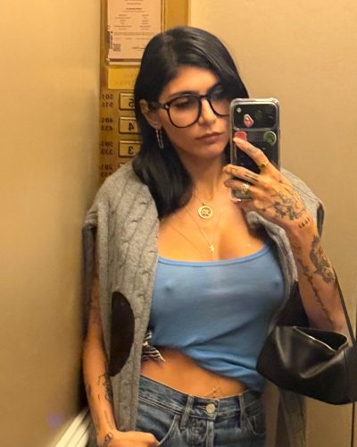 Mia Khalifa in black top and comfortable flared pants.