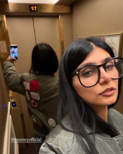 Mia Khalifa in black flared pants and trendy footwear.