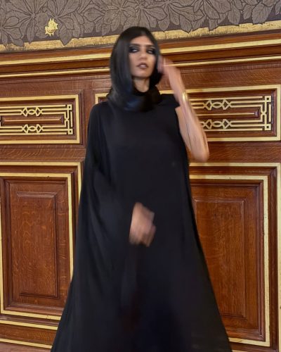 Mia Khalifa black cape with minimal accessories