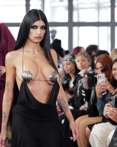 Mia Khalifa black dress featuring sharp lines and soft drape