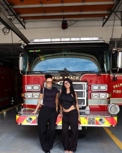 Mia Khalifa in a casual white dress complemented by black flats.
