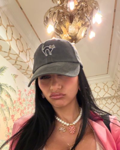 Mia Khalifa with layered chains and intricate pendants.