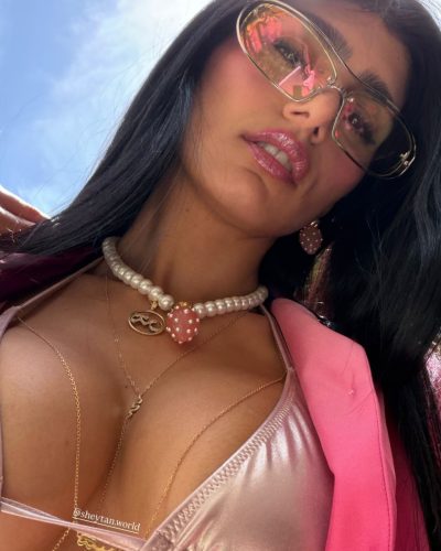 Mia Khalifa sporting stylish pearl necklace and layered chains.