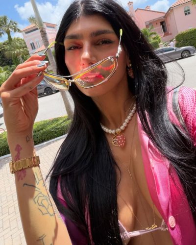 Mia Khalifa with colorful drink in pink bikini