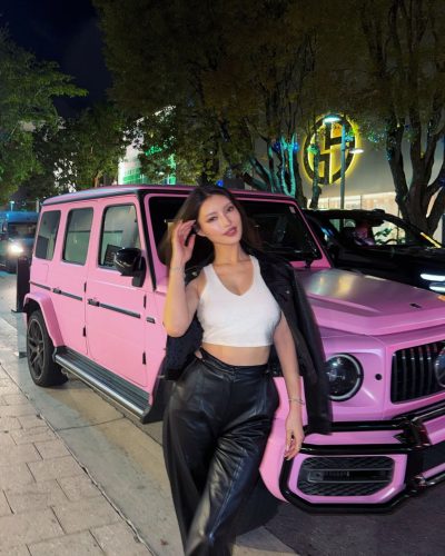 Mika Takeuchi in white crop top paired with black leather