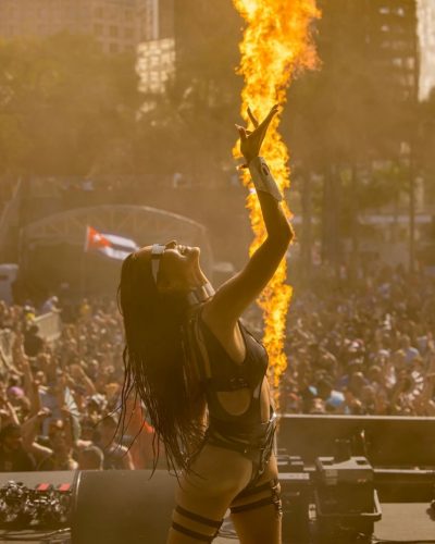 Mika Takeuchi dressed in black jumpsuit with chic silver details