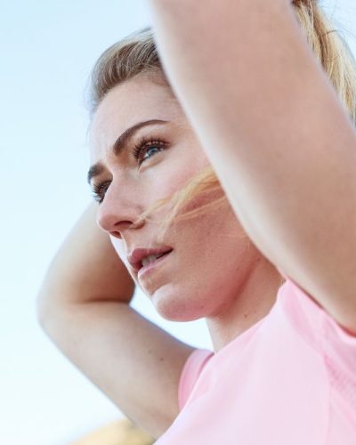 Mikaela Shiffrin in red sports bra and high-waisted leggings.