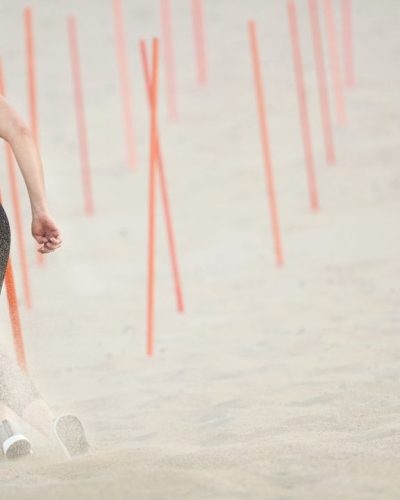 Mikaela Shiffrin in pink workout top with black fitted leggings.