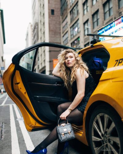 Mikaela Shiffrin wearing yellow jacket and blue footwear