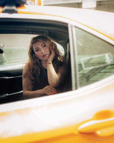 Mikaela Shiffrin in yellow jacket with black stripes