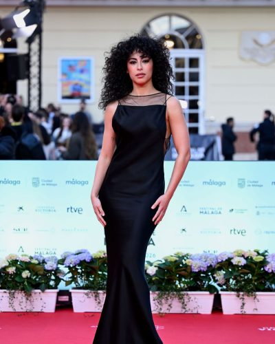 Mina El Hammani in black dress with shimmering fabric