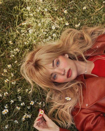 Miranda Kerr dressed in a vibrant floral white dress