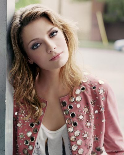 Mischa Barton in a light pink dress with a sophisticated design.