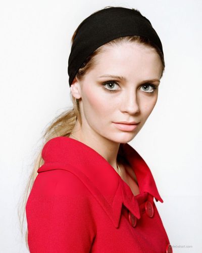 Mischa Barton eye-catching dress in purple, mint green, and black.