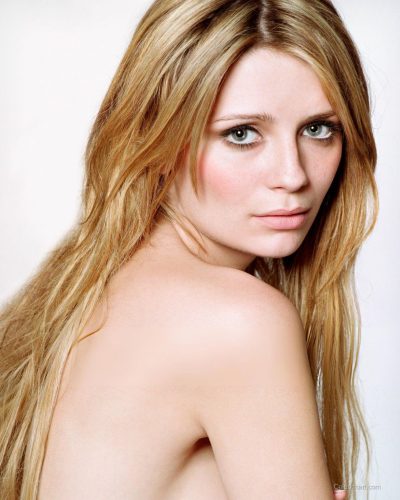 Mischa Barton playful jumpsuit featuring bold black and pastel hues.