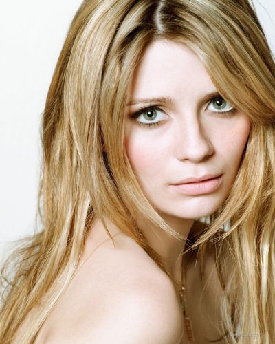 Mischa Barton chic dress with geometric designs in soft pastel shades.