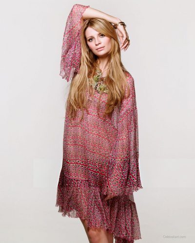 Mischa Barton fashionable gown with bold patterns and alluring neckline.