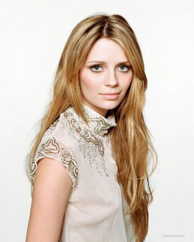 Mischa Barton fitted gown with plunging neckline in vibrant colors.