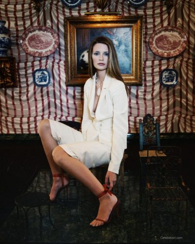 Mischa Barton in white blazer with vibrant coral heels