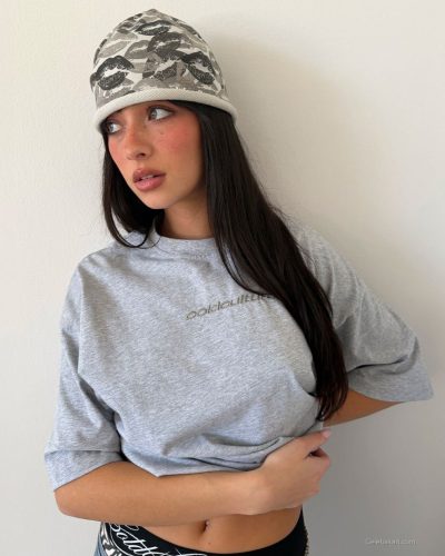 Mishka Silva wearing light jumpsuit with daring neckline