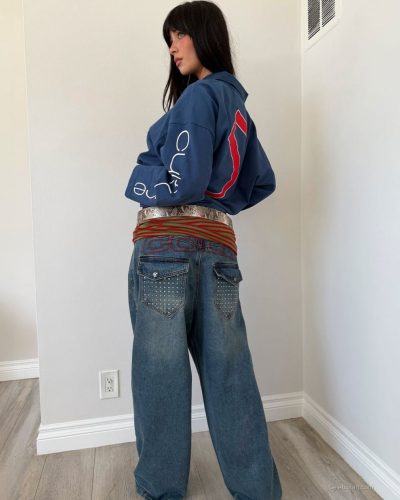 Mishka Silva with deep neckline jumpsuit and stylish accessories