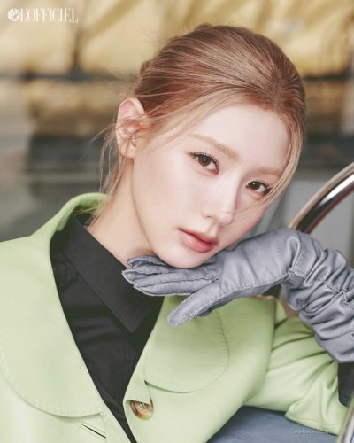 Miyeon in red oversized sweatshirt paired with lilac shorts