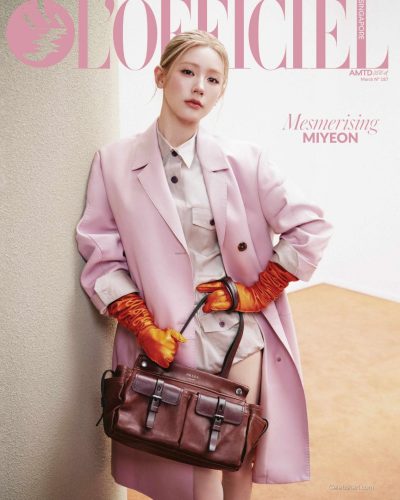 Miyeon in bright red sweatshirt and chic lilac shorts