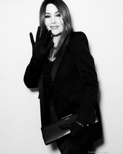 Monica Bellucci with long hair and black gloves.