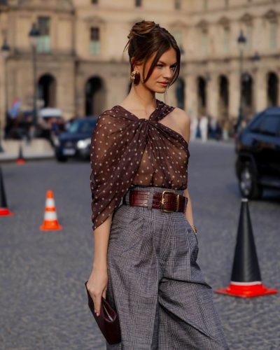 Nadine Leopold wearing bold wide belt with checkered high-waisted trousers