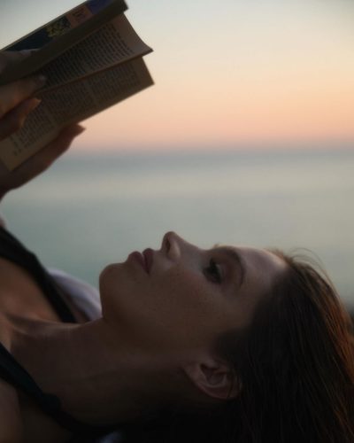 Naila Van Kommer in brown dress featuring a sleek silhouette