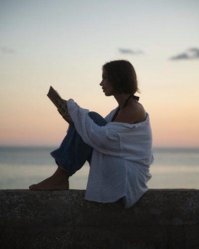 Naila Van Kommer wearing structured brown dress with minimal accessories