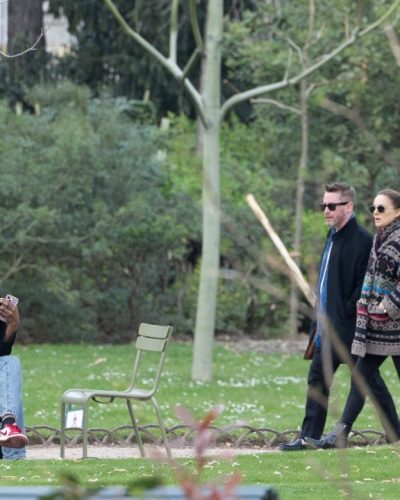 Natalie Portman colorful accent coat with black fitted trousers