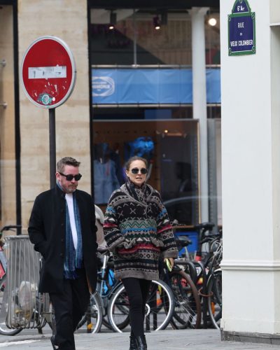 Natalie Portman loose bun hairstyle with subtle makeup and sunglasses