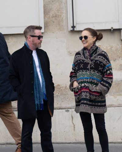 Natalie Portman stylish black ankle boots with a patterned coat