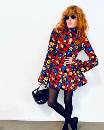 Natasha Lyonne high-waisted trousers emphasizing her silhouette