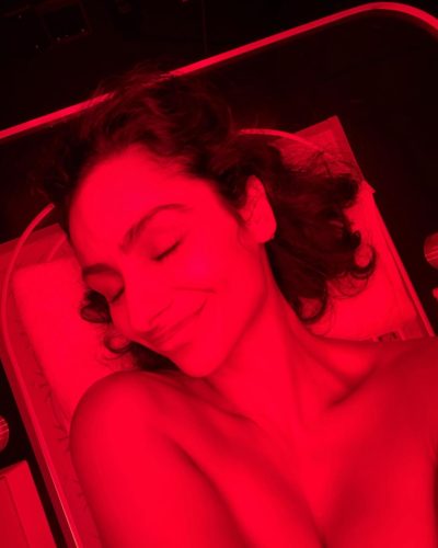 Nazanin Mandi in black leggings and refreshing smoothie