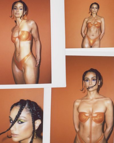 Nazanin Mandi in bold orange bikini with blue eyeshadow.