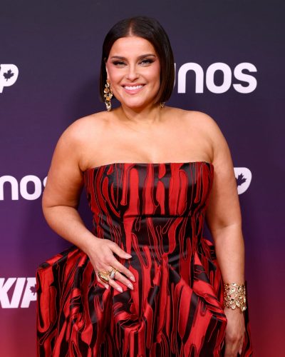 Nelly Furtado wearing a fitted bodice red gown