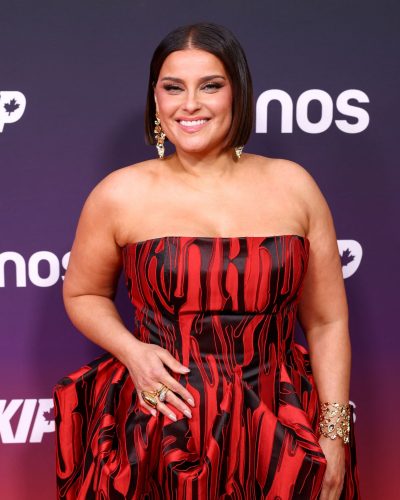 Nelly Furtado with sparkling jewelry and red gown