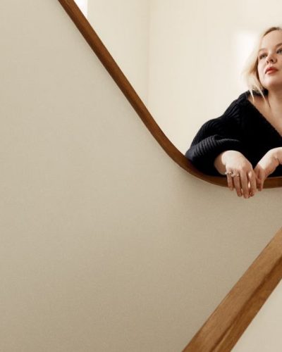 Nicola Coughlan black dress featuring playful white bow accent