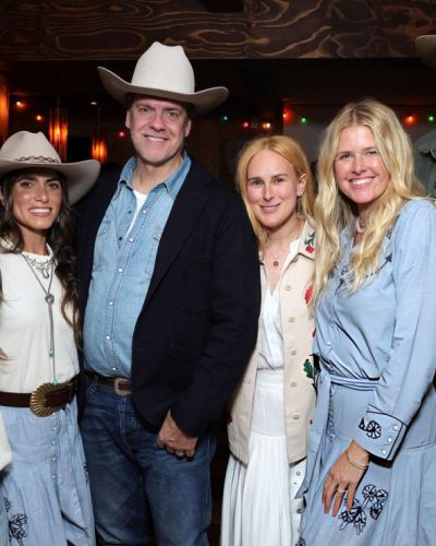 Nikki Reed with beige hat and layered jewelry