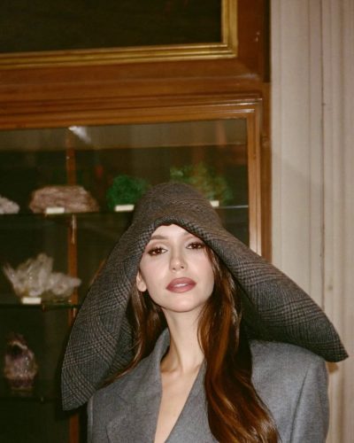 Nina Dobrev in gray coat complemented by soft waves