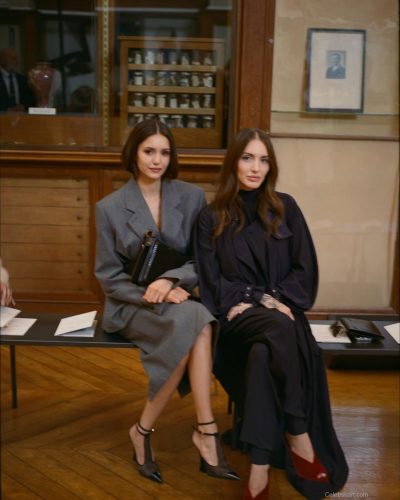 Nina Dobrev in contemporary gray coat with rich texture