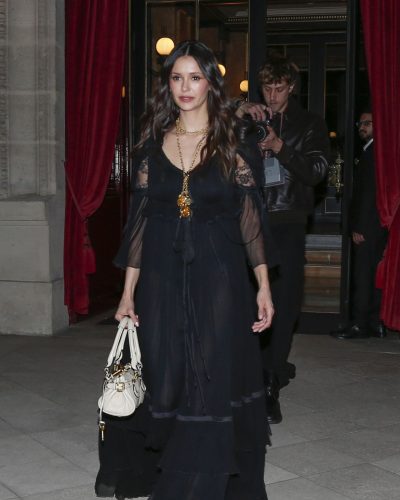 Nina Dobrev in a stylish black lace dress