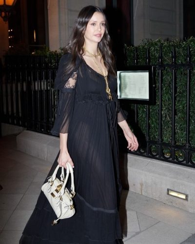 Nina Dobrev sporting a contemporary black dress